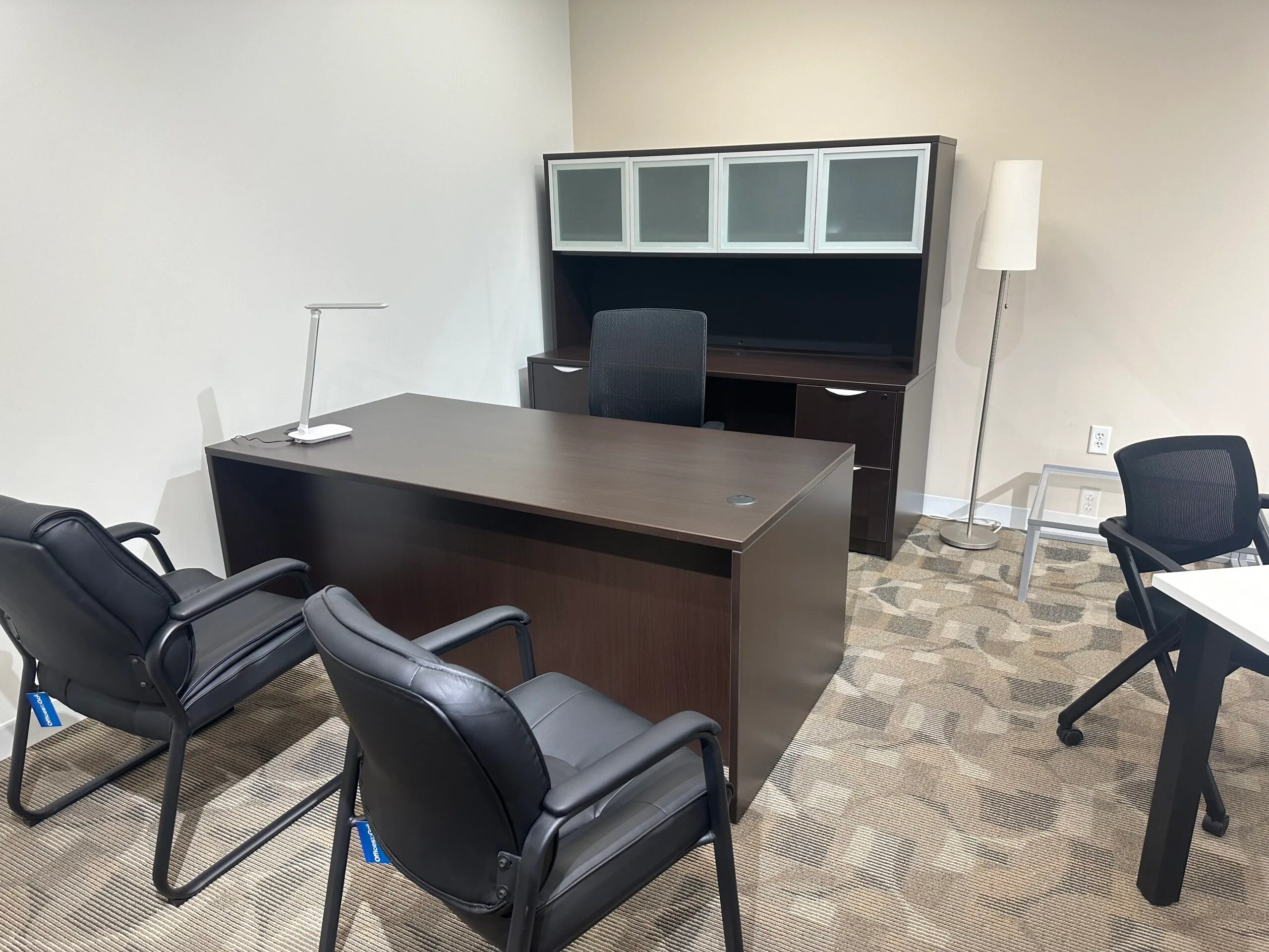 an office cubicles with desks and chairs